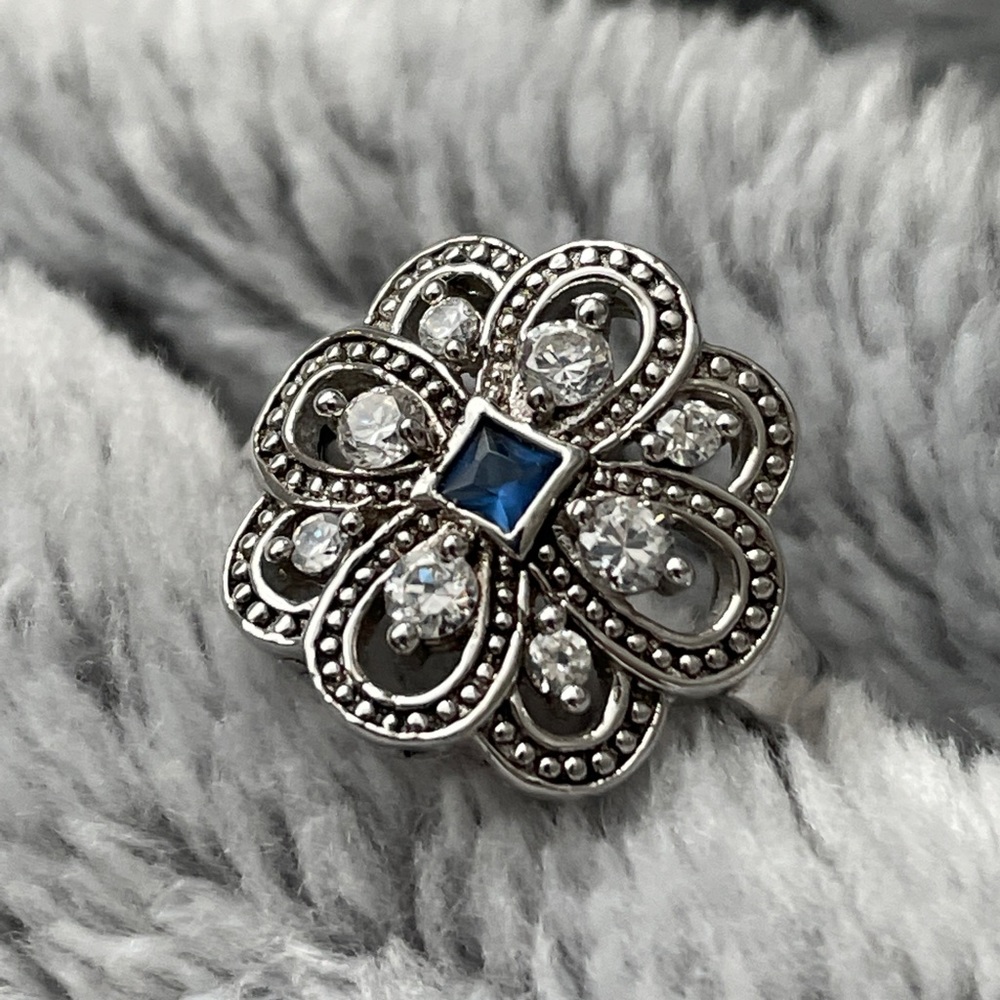 Sterling silver cocktail ring with blue and white stones
